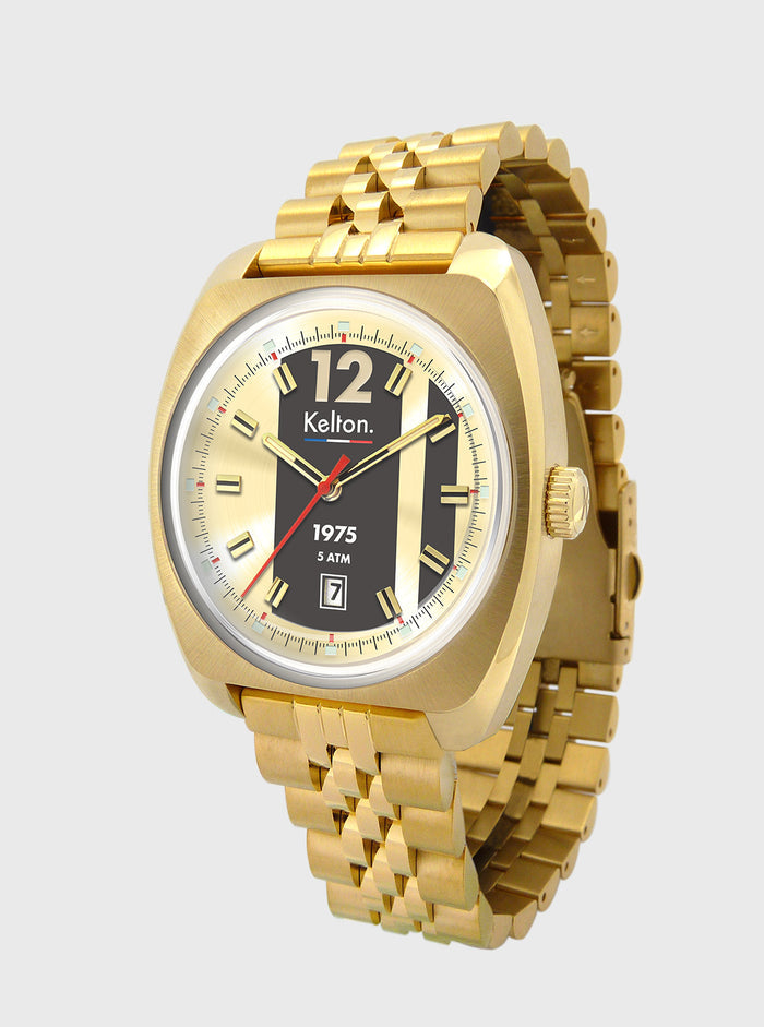 Montre acier doré, cadran noir, index lumineux, logo Kelt... et date 7.