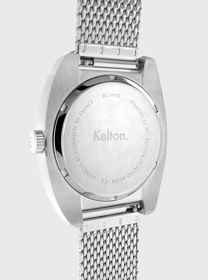 Boîtier arrière de montre Kelton RC 1975 en métal argenté, bracelet maille ajustable.