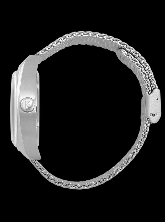 Montre Kelton RC 1975 vue de côté, boîtier argent et bracelet maille chaîne.