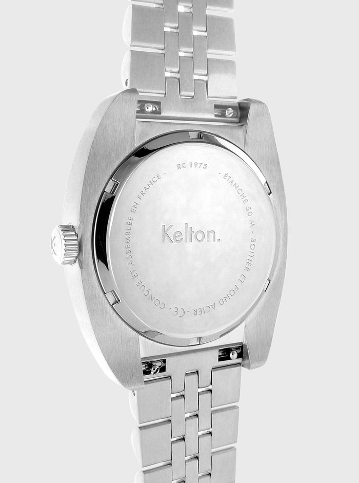 Boîtier arrière de montre Kelton RC 1975 en acier, gravures et bracelet à maillons