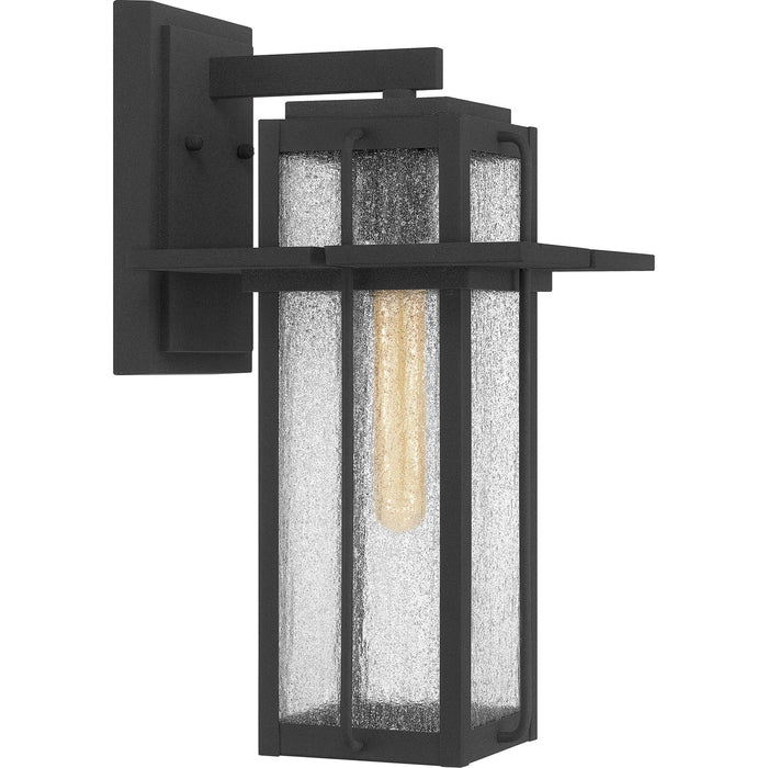 Mottled black wall sconce, by Quoizel, for hallway or living room